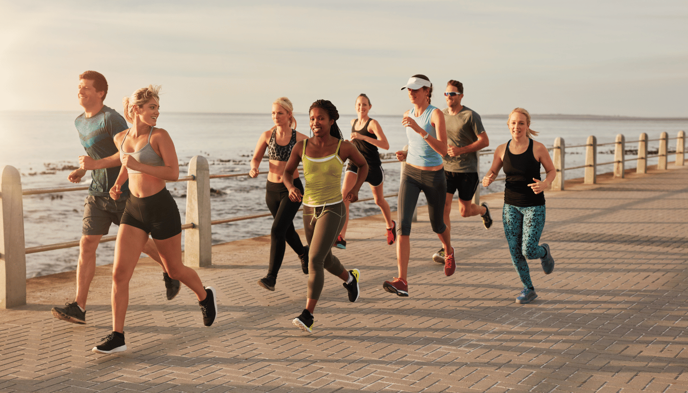 Mixed group of young runners on the boardwalk