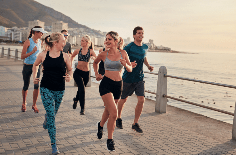 Young runners enjoying running on the boardwalk