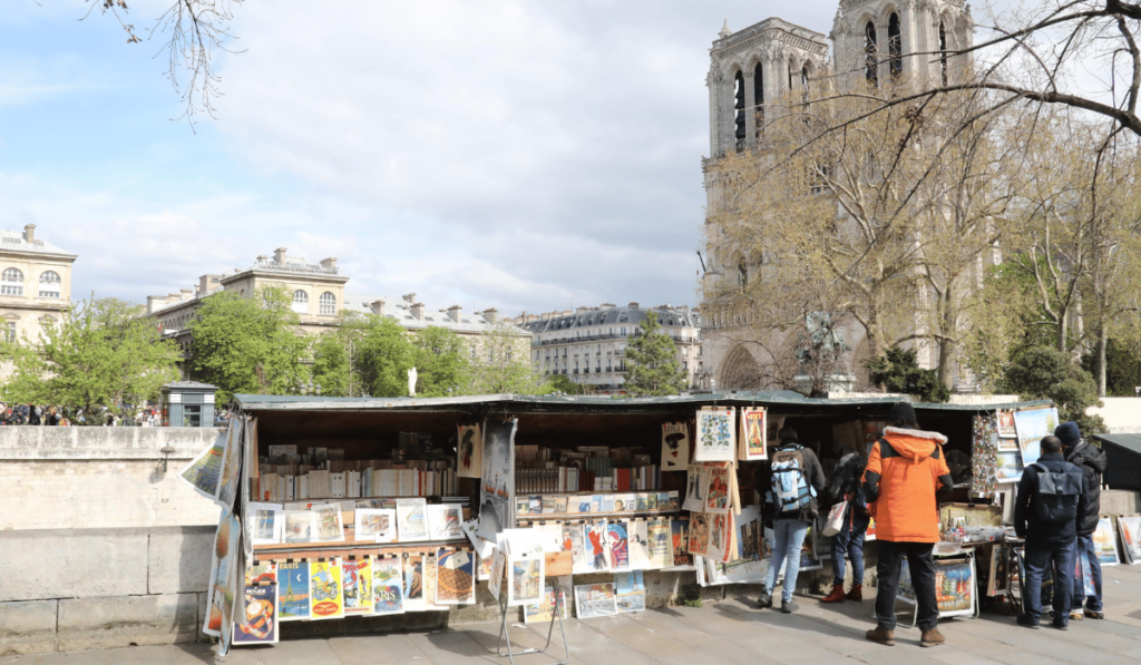 Bouquiniste stall along the Seine, Notre Dame de Paris in the background