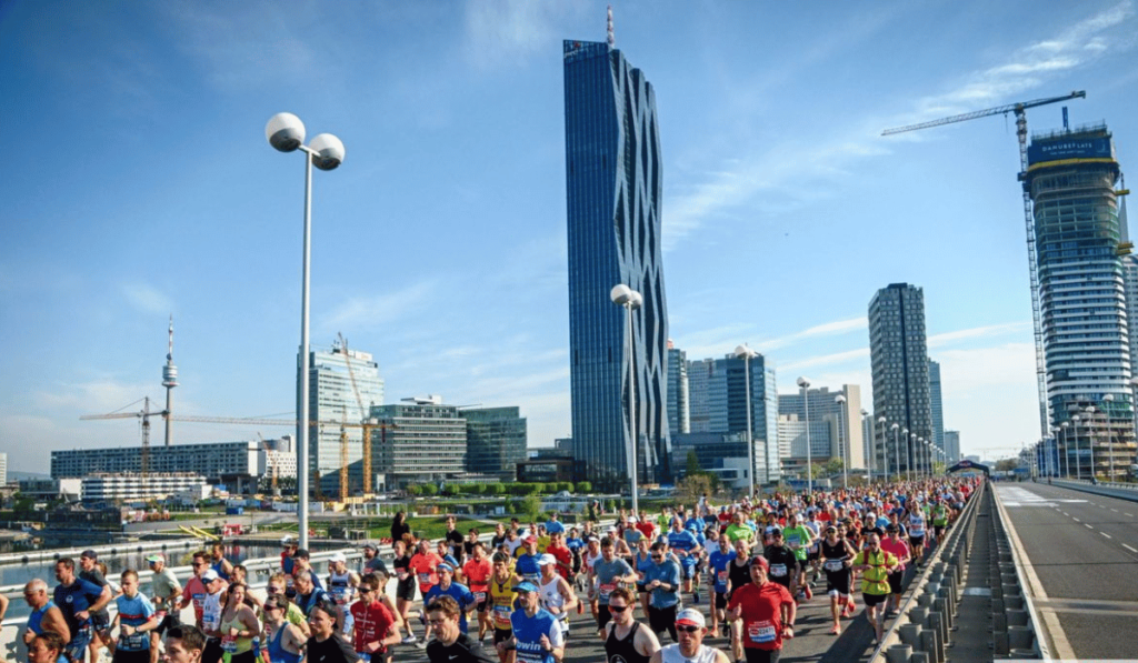 Runners cross the Danube over Reichsbrücke